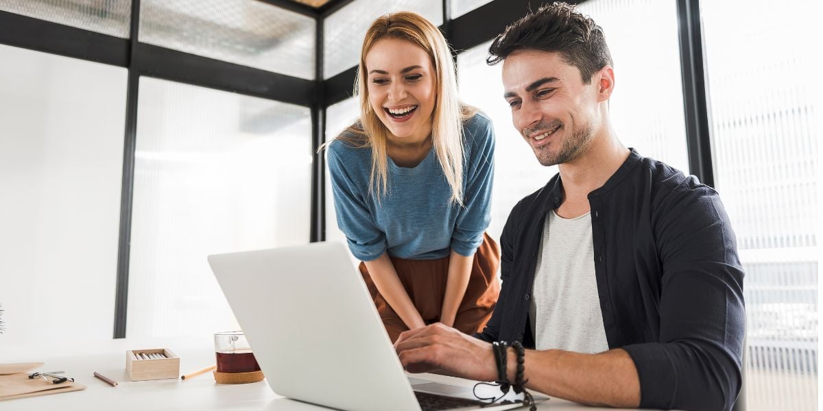 Workers looking at laptop